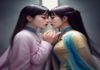 LGBT纪录片拍摄场景配图，摄影师手持摄像机在城市街头采访，背景是彩虹旗装饰的建筑